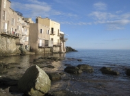Houses are built right onto the rocks. These ones are low to the sea but others are perched high above it.