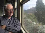 Doug is happily enjoying the high-altitude scenery, thankful neither of us is driving! We are thousands of feet high here.